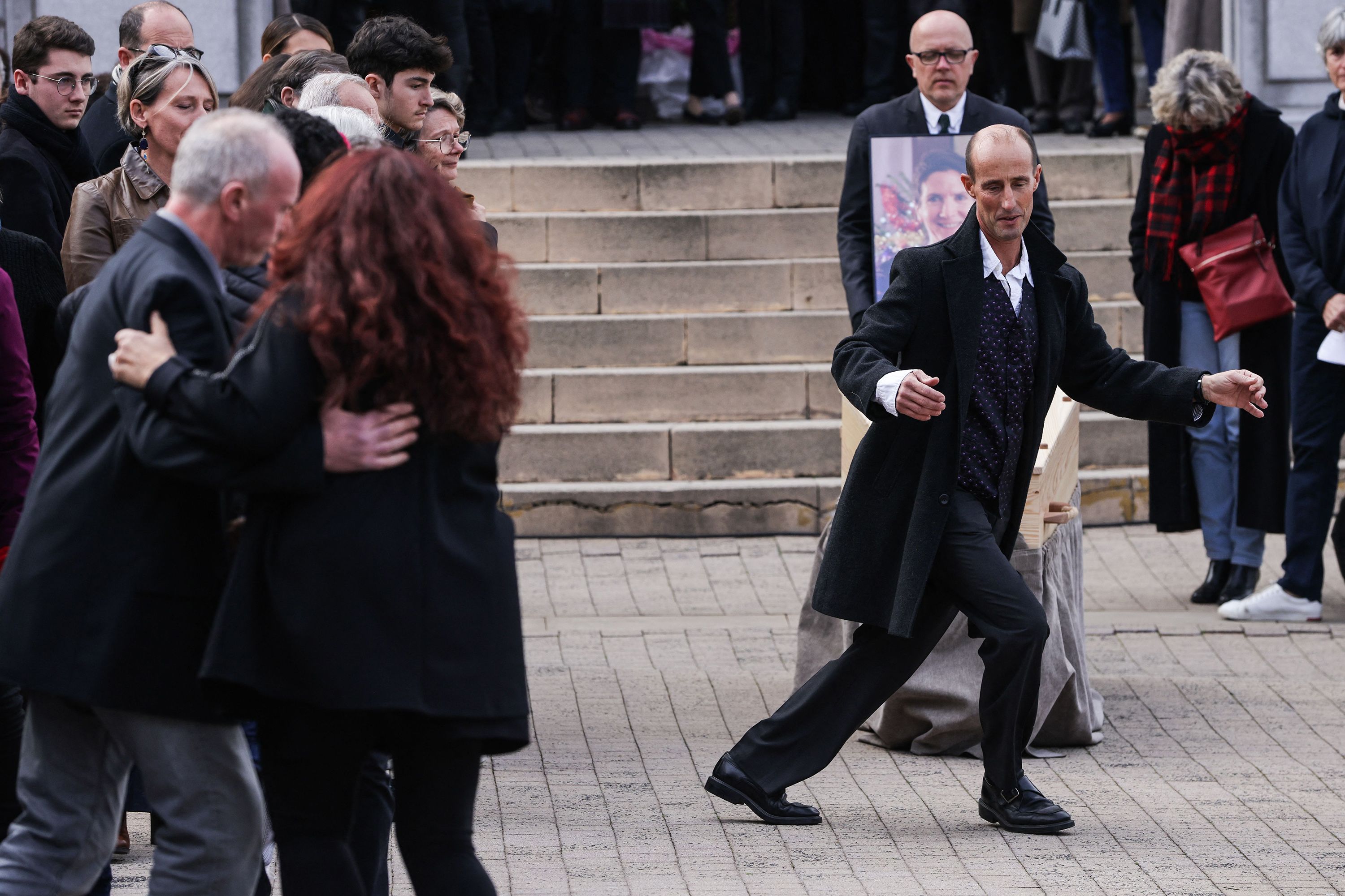 Stéphane Voirin dances in front of the coffin of his partner, Agnès Lassalle, as he pays tribute to her in front of a church in Biarritz, France, on Friday, March 3.