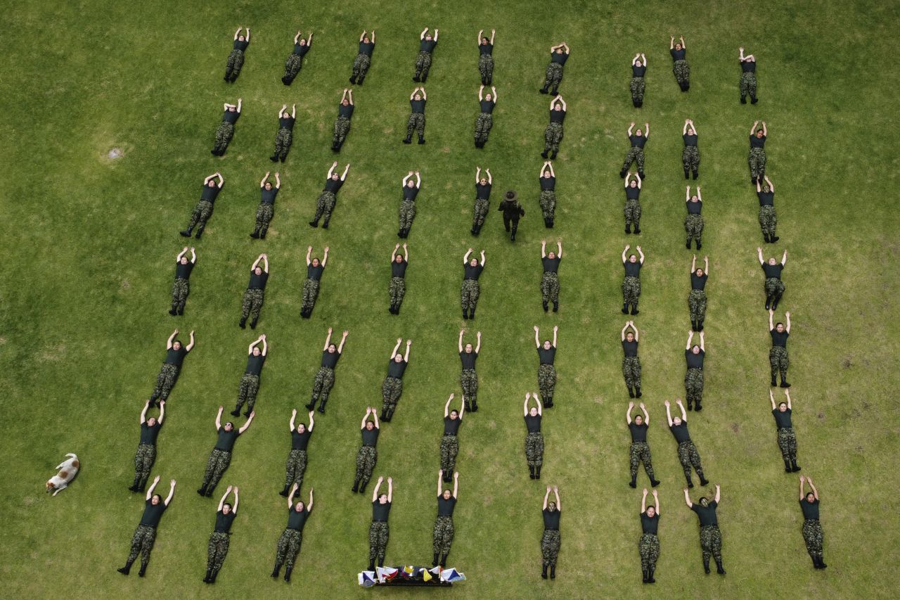 Female army recruits attend a three-month training program at a military base in Bogota, Colombia, on Monday, March 6. After a 25-year ban, the Colombian army is once again allowing women to join its ranks through voluntary military service.