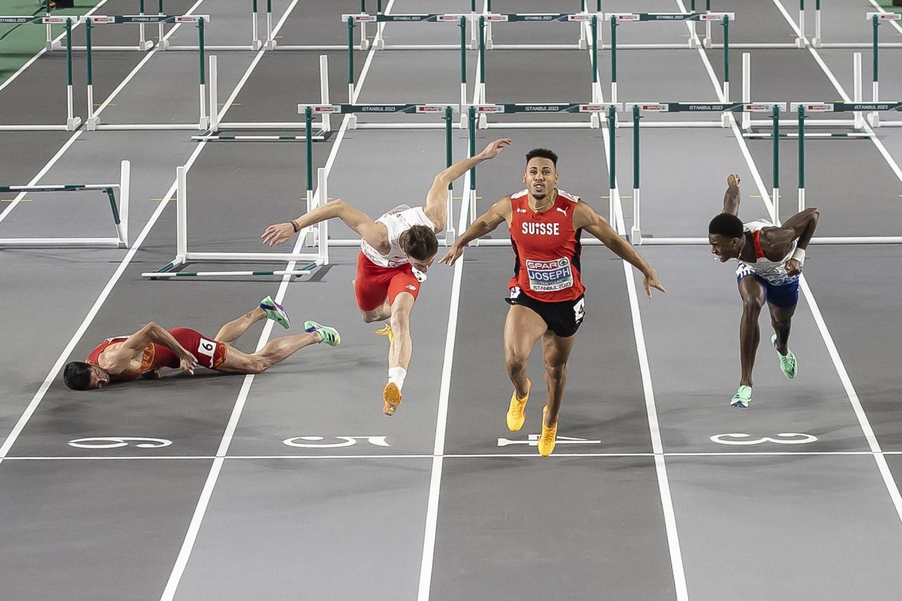 Swiss hurdler Jason Joseph, second from right, wins the 60-meter final at the European Indoor Championships on Sunday, March 5. Spain's Enrique Llopis, left, fell just before the finish line and <a href=