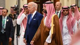US President Joe Biden (L) and Saudi Crown Prince Mohammed bin Salman (R) arrive for the family photo during the Jeddah Security and Development Summit at a hotel in Saudi Arabia's Red Sea coastal city of Jeddah on July 16, 2022.