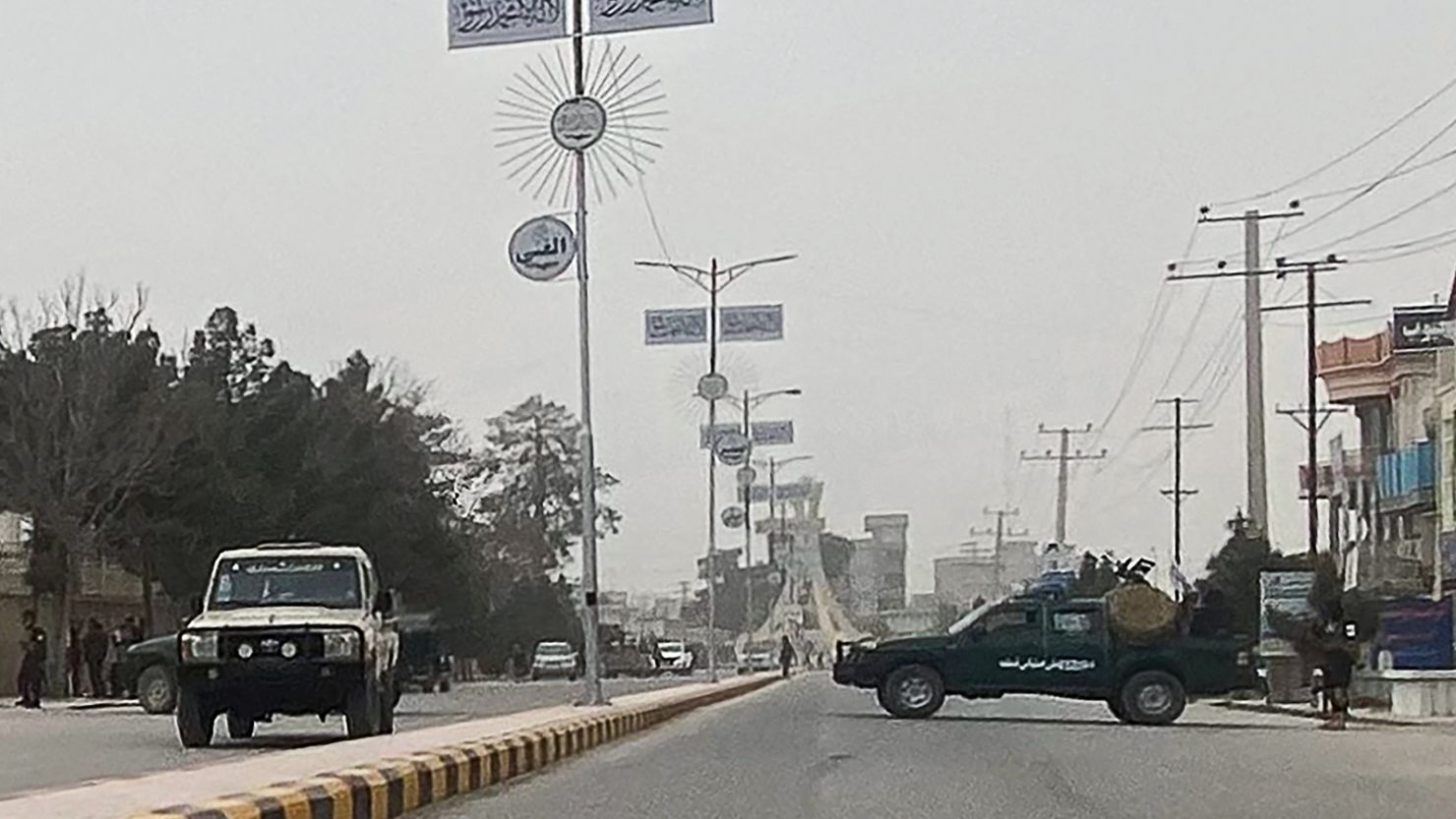 Taliban security personnel block a road in Mazar-i-Sharif, Balkh province, after a blast at the governor's office on March 9, 2023.