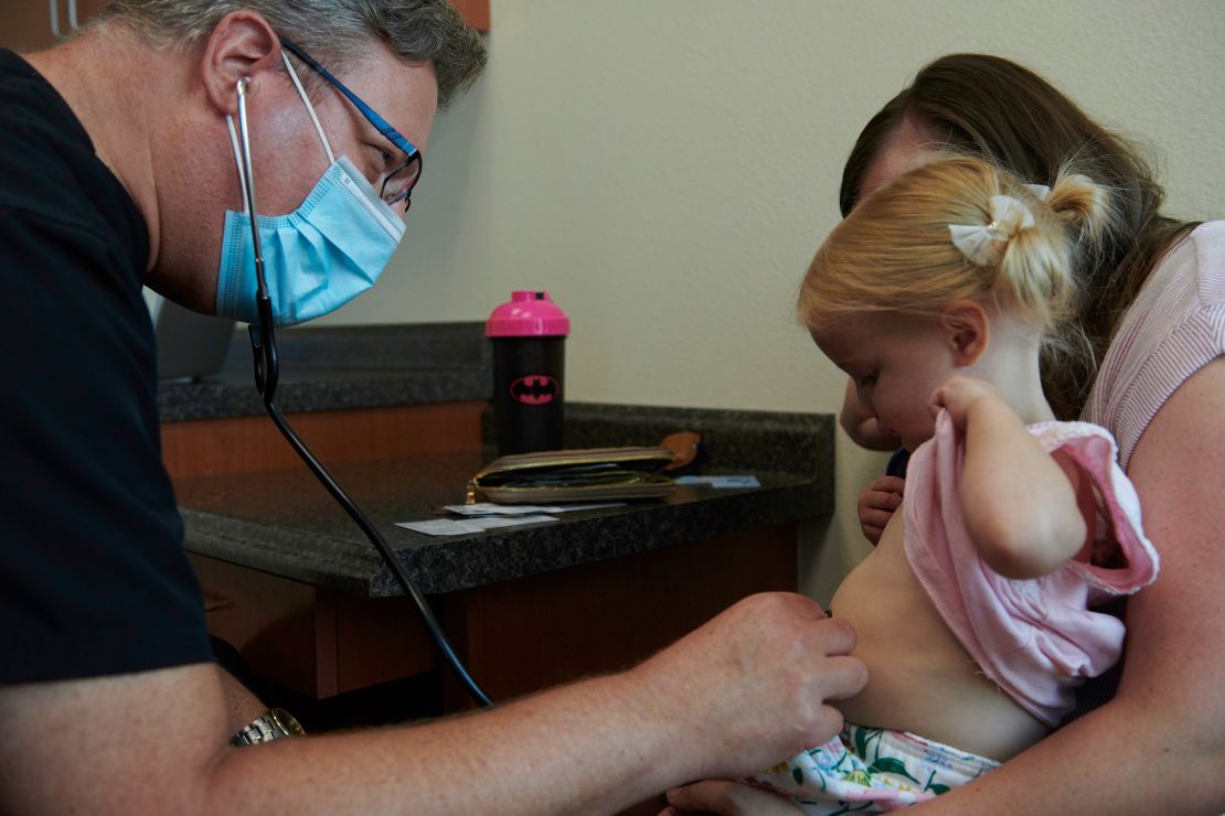 Pediatric gastroenterologist Dr. Howard Baron visits with a patient in 2020 in Las Vegas. A large portion of his patients are on Medicaid with reimbursement rates that are far below private insurers.