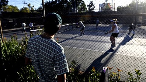 People play pickleball on what were once tennis courts at Allendale Park in Pasadena, CA, in 2022. 