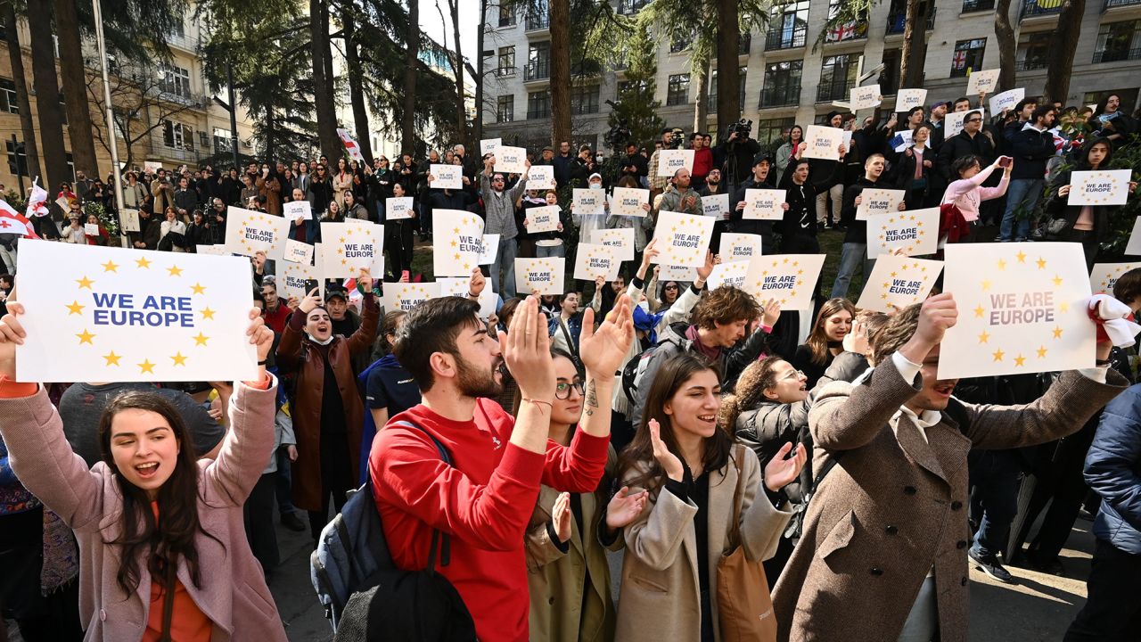 Georgian protesters celebrate outside the parliament as lawmakers vote to call off controversial "foreign agent" bill on Friday March 10, 2023.