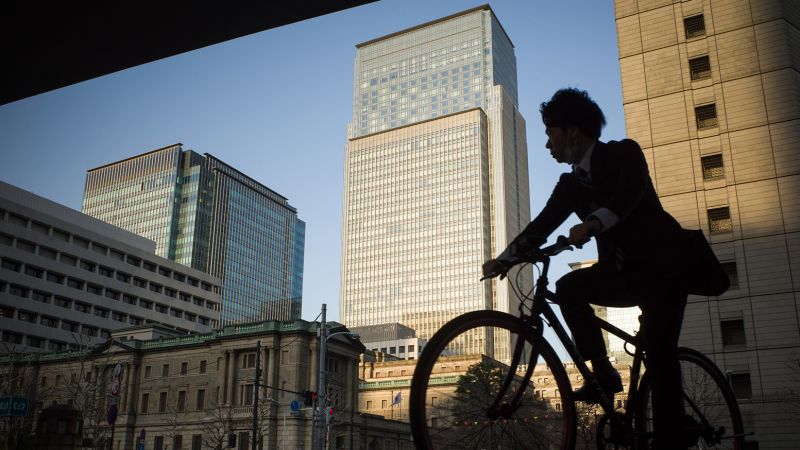 Bank of Japan keeps low rates as Kuroda sticks to script at swan song meeting | CNN Business