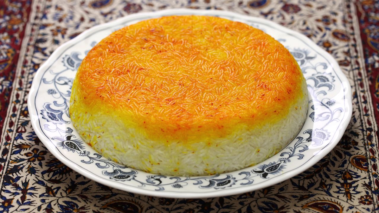 Tahdig means "bottom of the pot," referring to the dish's crispy golden crust of cooked rice.