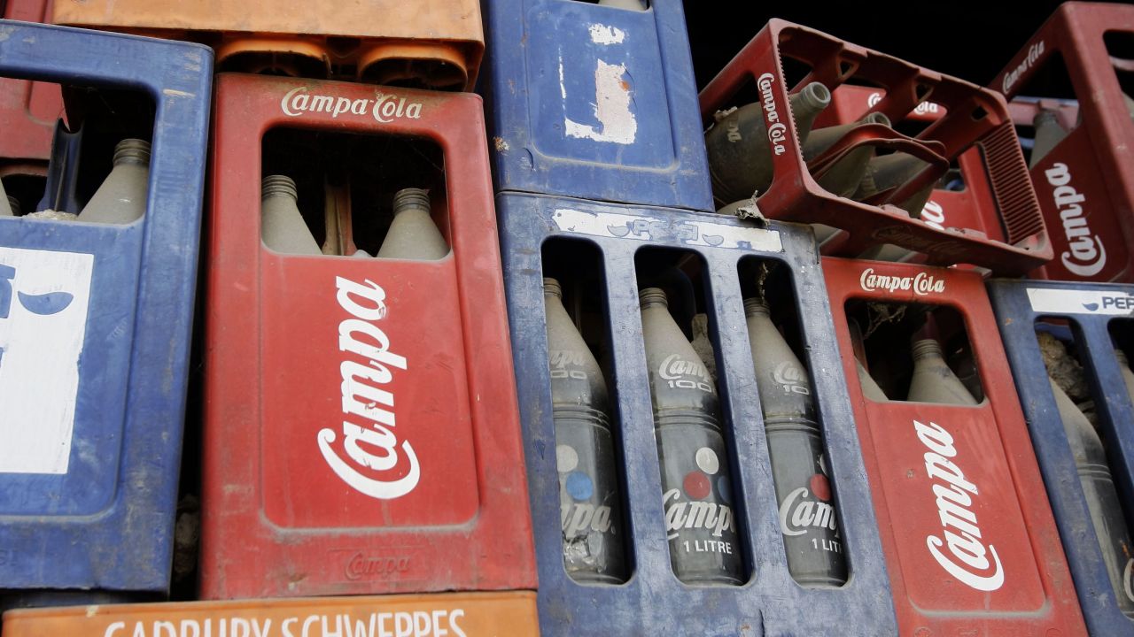 Crates of old bottles at a dilapidated Campa Cola factory in New Delhi, India, on Monday, Feb. 9, 2009. The former headquarters has been shuttered for years but the brand may be about to make a comeback.