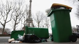 Garbage cans are seen near the Eiffel Tower in Paris on Friday.