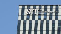 SEOUL, SOUTH KOREA - FEBRUARY 10: A sign on the exterior of new building for SM Entertainment building is seen on February 10, 2023 in Seoul, South Korea. HYBE announced a deal on Friday to buy a 14.8% stake in rival SM Entertainment. (Photo by Han Myung-Gu/WireImage)