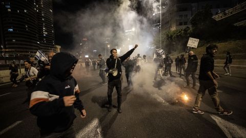Protesters clash with police during protests in Tel Aviv on Saturday.