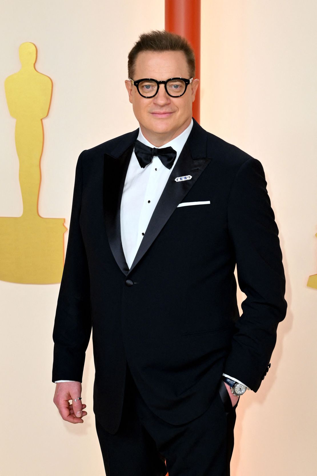 Brendan Fraser, Best Leading Actor nominee for his role in "The Whale," wore a Giorgio Armani suit topped off with a bow tie and paired with an Omega watch.
