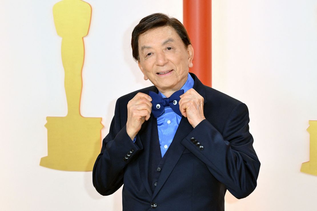 James Hong arrived wearing one of the night's boldest accessories: a blue bowtie adorned with — in a nod to "Everything Everywhere All at Once" — a pair of googly eyes. 