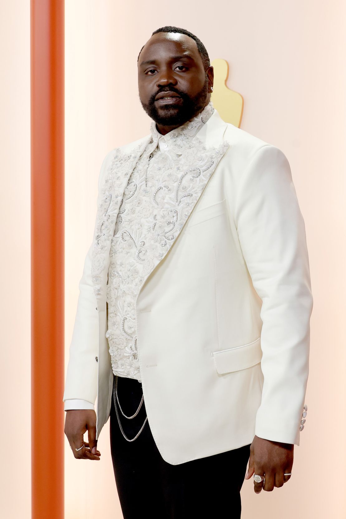 Brian Tyree Henry, nominated for Best Supporting Actor, wore a white double-breasted Dolce & Gabbana jacket with floral embellishments. 