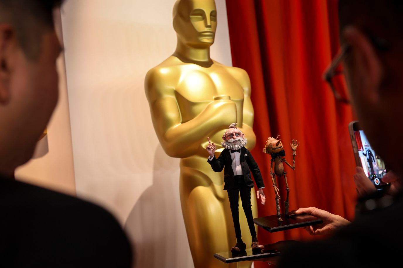 Puppets from "Guillermo del Toro's Pinocchio" are displayed at the Dolby Theatre. The film later won the Oscar for best animated feature.