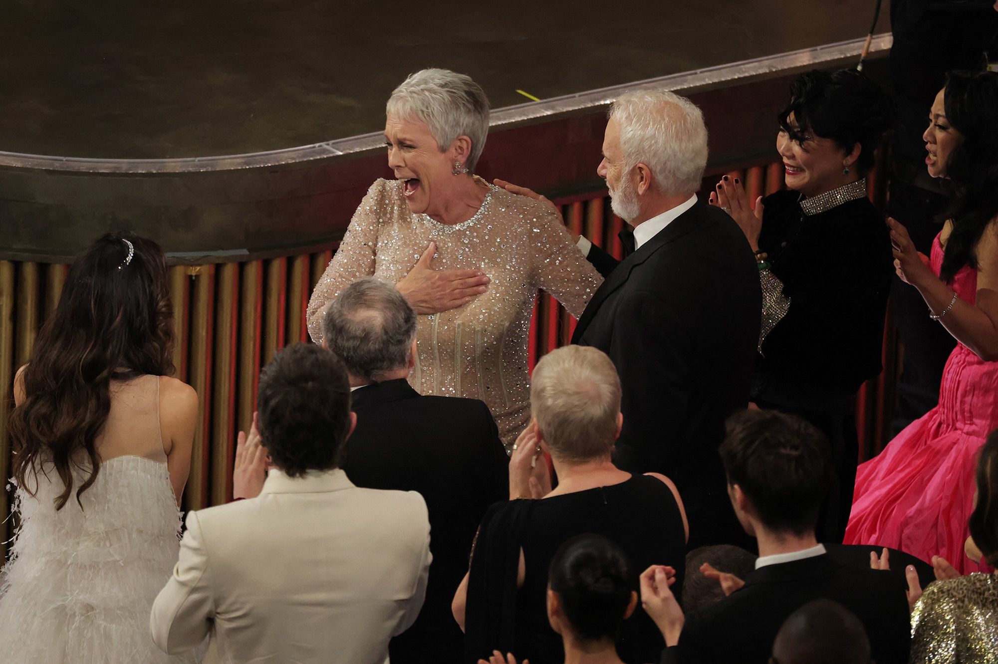 Curtis reacts after winning the Oscar for best supporting actress. She appeared to be truly surprised upon hearing her name, yelling "shut up" from her seat when she was announced.