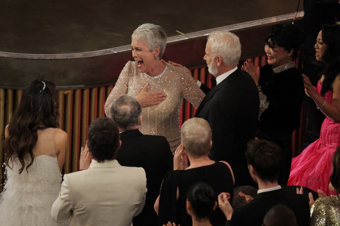 Curtis reacts after winning the Oscar for best supporting actress. <a href="index.php?page=&url=https%3A%2F%2Fwww.cnn.com%2Fentertainment%2Flive-news%2Foscars-2023%2Fh_e8f449020a786b7353fc0d250e4c3bbb" target="_blank">She appeared to be truly surprised</a> upon hearing her name, yelling "shut up" from her seat when she was announced.