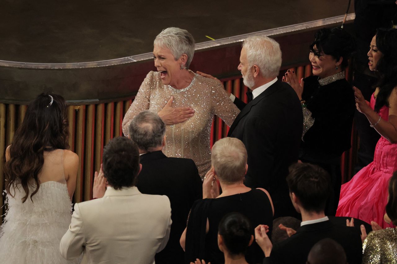 Curtis reacts after winning the Oscar for best supporting actress. <a href=