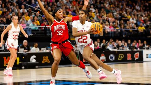 Chloe Moore-McNeil (22) of the Indiana Hoosiers drives to the basket while Cotie McMahon (32) of the Ohio State Buckeyes defends in the second half of the game in the semifinals of the Big Ten Women's Basketball Tournament.