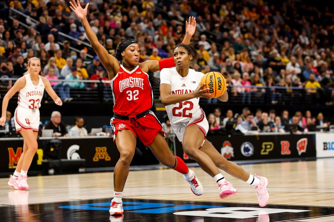 Chloe Moore-McNeil (22) of the Indiana Hoosiers drives to the basket while Cotie McMahon (32) of the Ohio State Buckeyes defends in the second half of the game in the semifinals of the Big Ten Women's Basketball Tournament.