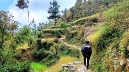 Man hiking in rural landscape, Nepal Valley