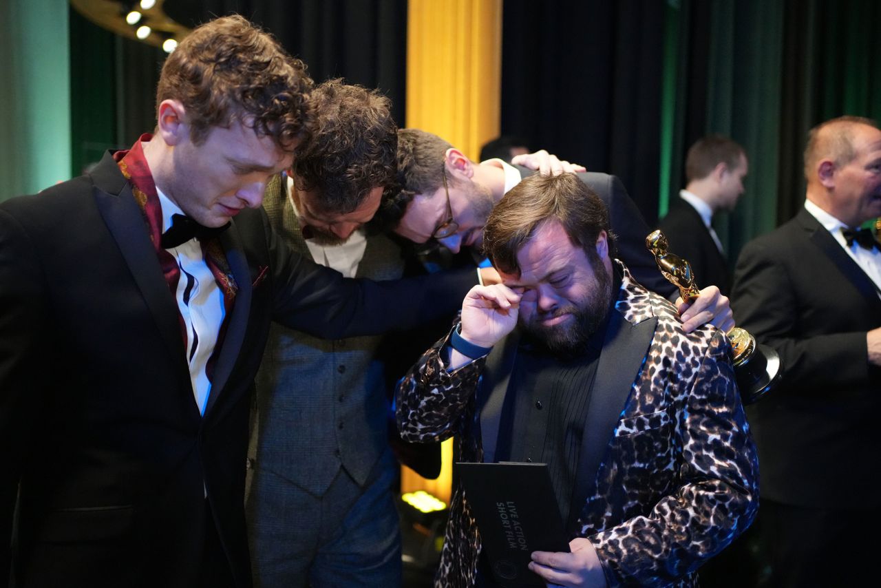 Ross White, Seamus O'Hara, Tom Berkeley and James Martin share an emotional moment backstage after "The Irish Goodbye" won the Oscar for best live action short film. Martin, right, received an <a href="https://www.cnn.com/entertainment/live-news/oscars-2023/h_c29518f5916f2f49ab1837b26752a0a4" target="_blank">unexpected surprise</a> during the acceptance speech. His co-stars told the audience that they wanted to sing him "Happy Birthday," and they did. The audience sang along.