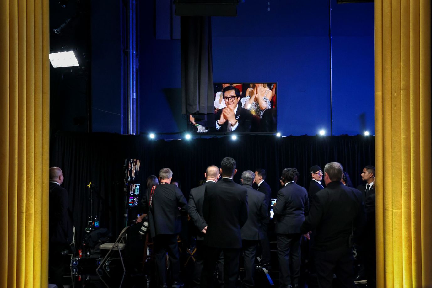 Actor Ke Huy Quan is seen on a monitor backstage.