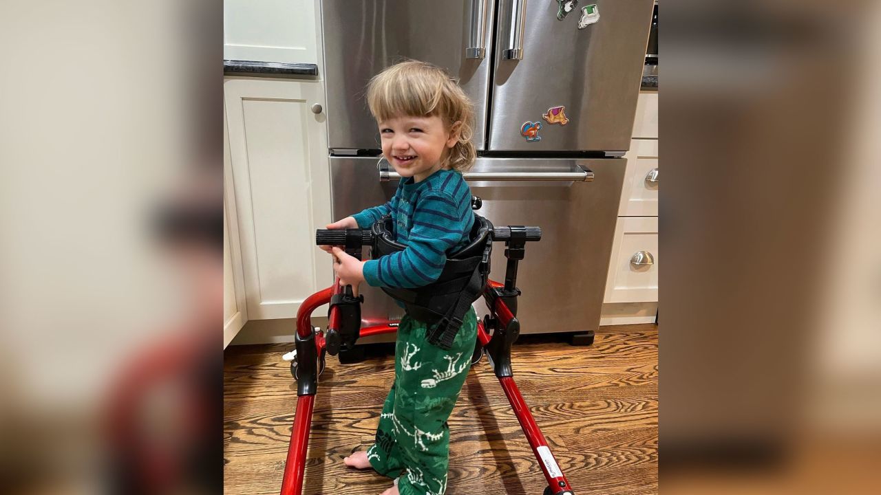 Henry Saladino is shown practicing how to walk using his walker.