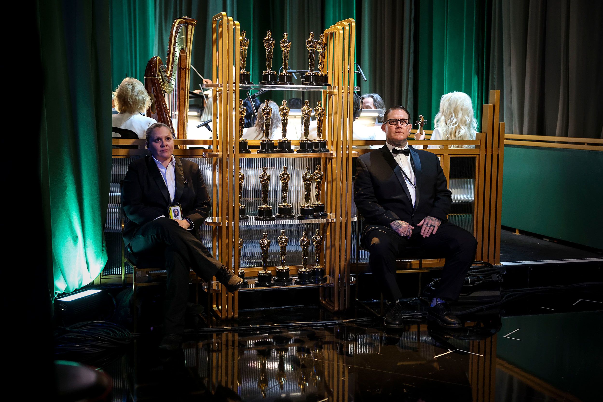 Oscar statuettes are seen backstage.