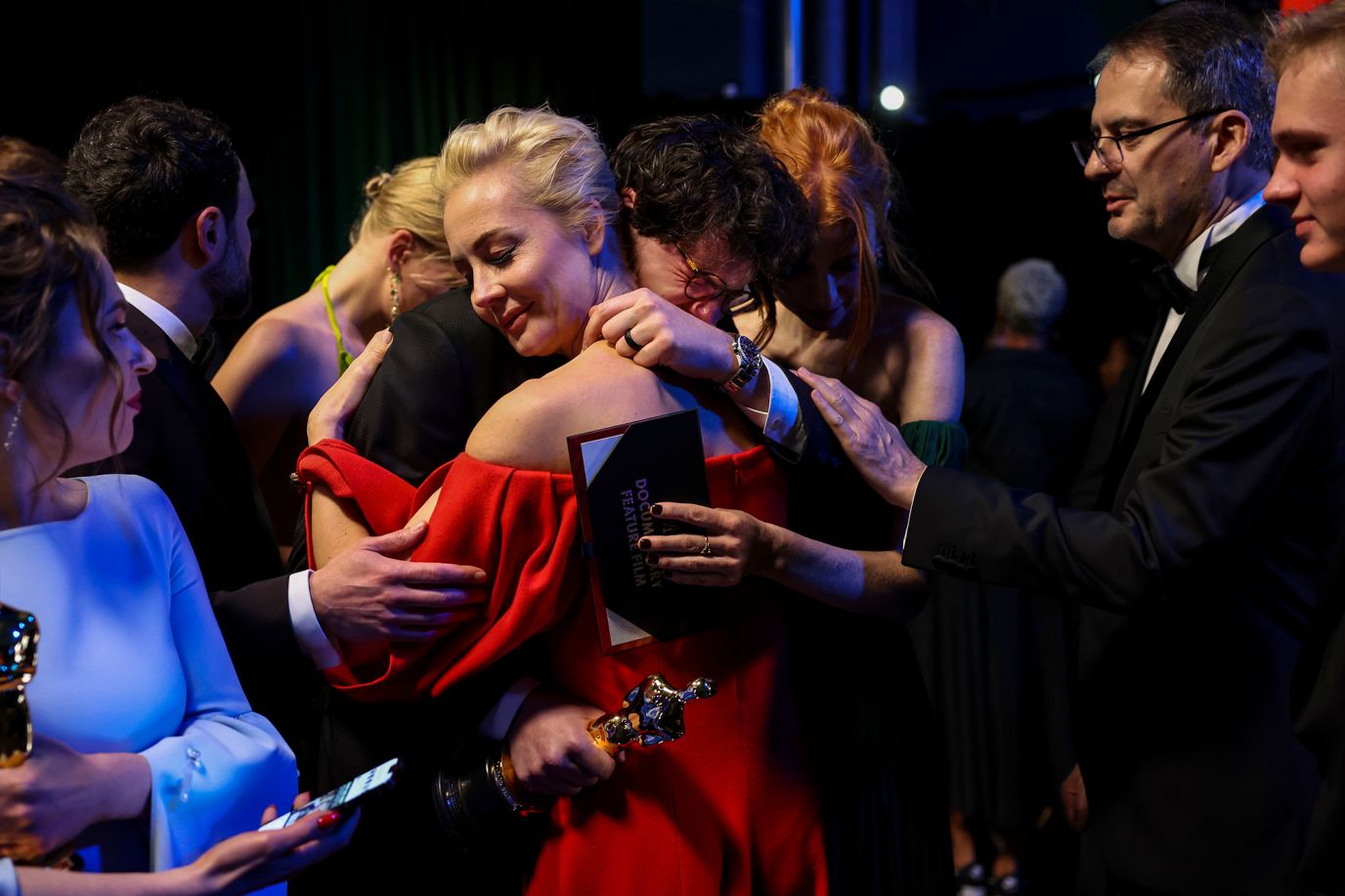 Yulia Navalny, wife of Russian opposition leader Alexey Navalny, hugs filmmaker Daniel Roher after "Navalny" won the Oscar for best documentary feature.