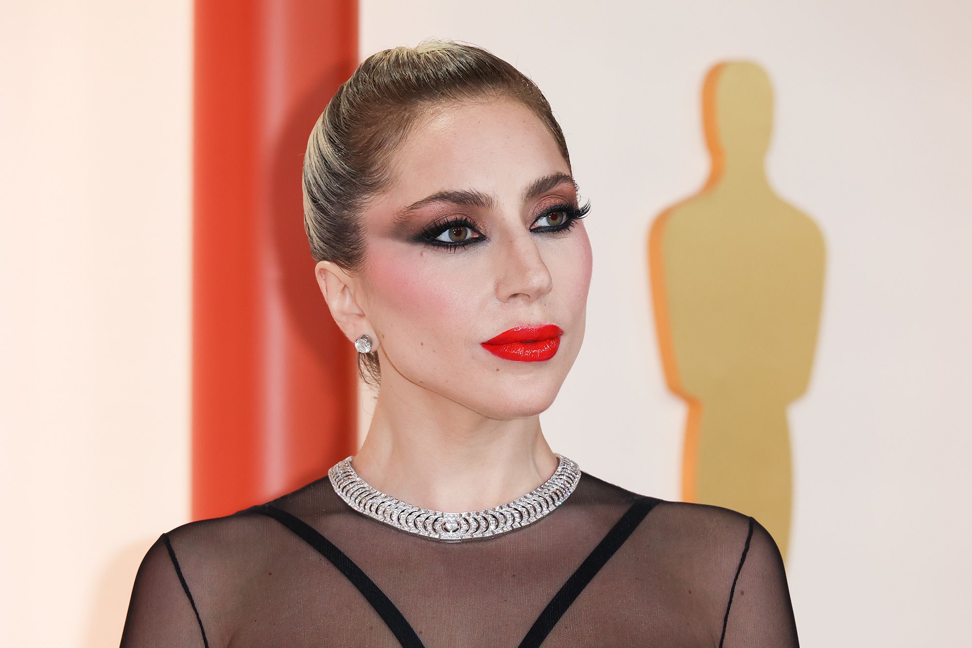 Lady Gaga wears fresh-off-the-runway Versace dress — as modelled by Gigi  Hadid