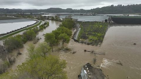 An aerial view of a collapsed dam and flooded river in Pajaro, California on March 12, 2023.