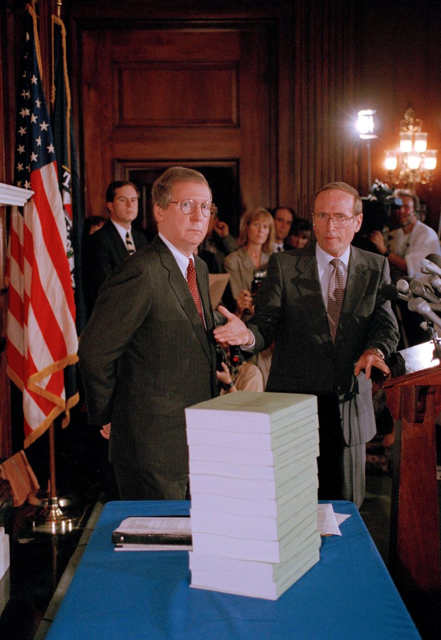 McConnell, left, and US Sen. Richard Bryan stand behind volumes detailing the Senate Ethics Committee's investigation of Sen. Bob Packwood in September 1995. The committee recommended that Packwood be expelled from Congress because of sexual and official misconduct. Ten women had accused him of sexual harassment. At the urging of even his closest colleagues, Packwood resigned.