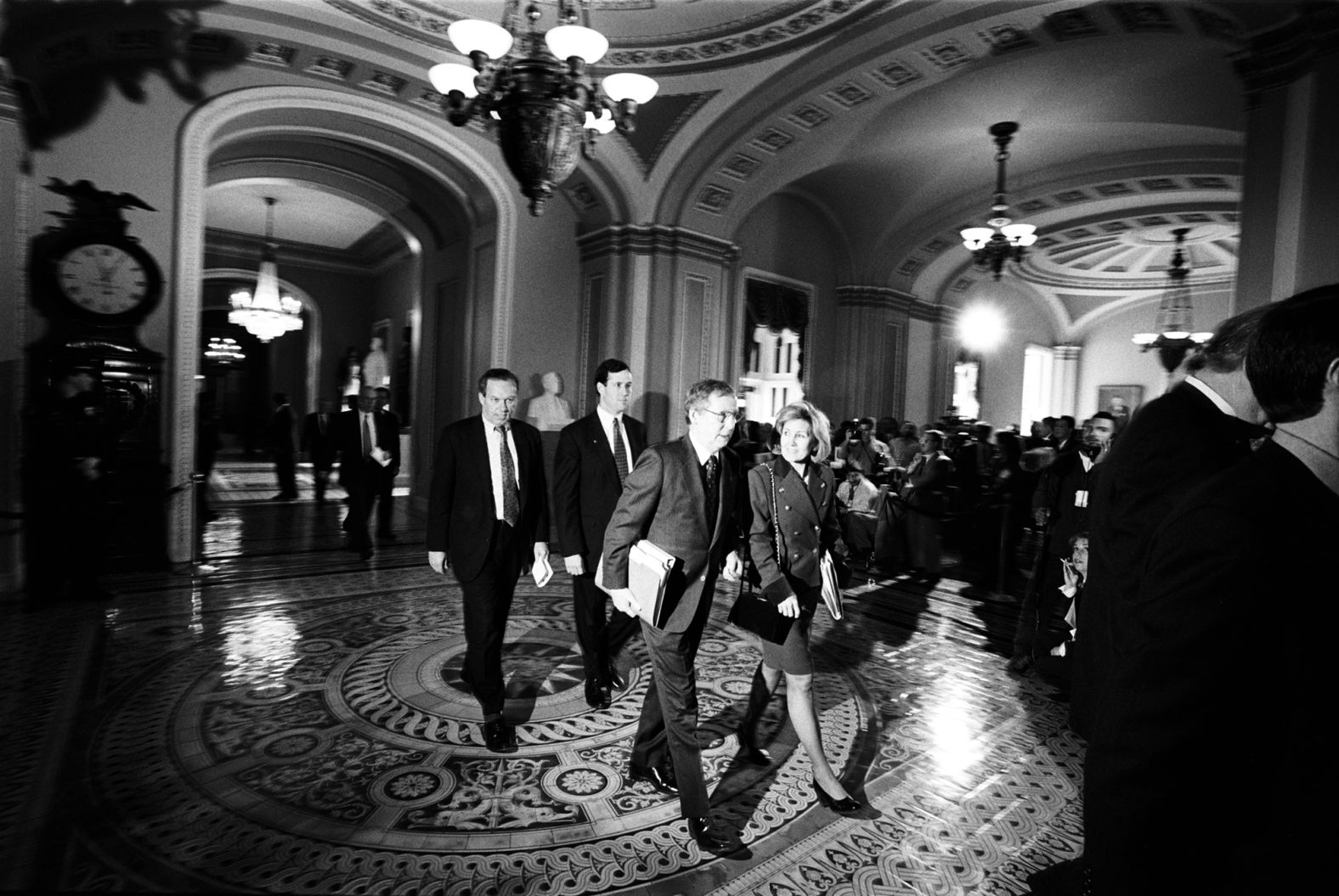 McConnell and Sen. Kay Bailey Hutchison walk in a Capitol hallway during the Senate impeachment trial of President Bill Clinton in February 1999.