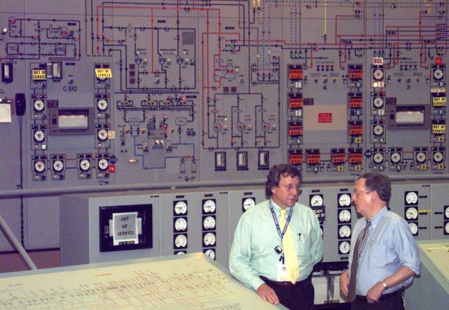 McConnell, right, is given a personal tour of a gaseous diffusion plant near Paducah, Kentucky, in August 1999. The plant produced enriched uranium until 2013.