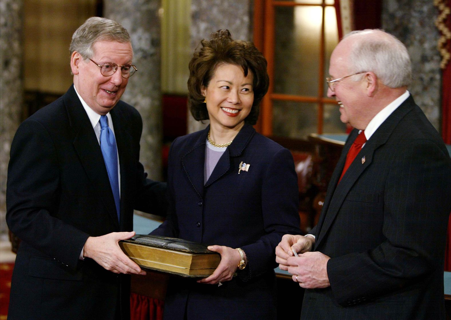 Vice President Dick Cheney jokes with McConnell and his wife, Elaine Chao, at his swearing-in reenactment in January 2003.