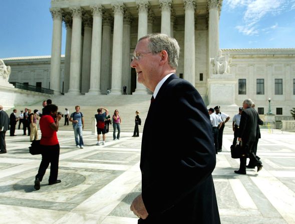 McConnell walks outside the Supreme Court in September 2003. McConnell was a survivor of polio as a child and has long walked with a slight limp.