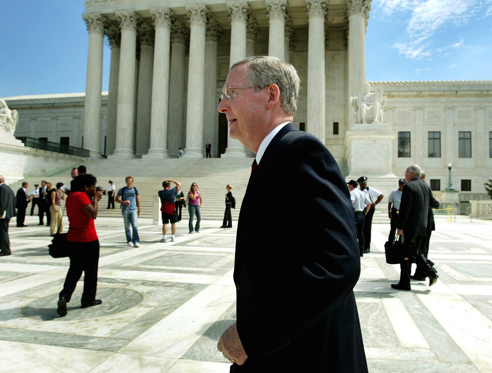 McConnell walks outside the Supreme Court in September 2003. McConnell was a survivor of polio as a child and has long walked with a slight limp.