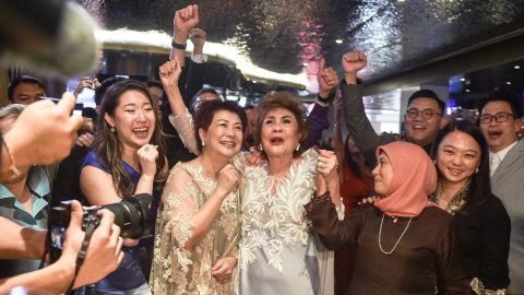Janet Yeoh (centre R), mother of actress Michelle Yeoh, celebrates at an event in Kuala Lumpur on March 13, 2023 after her daughter won an Oscar.