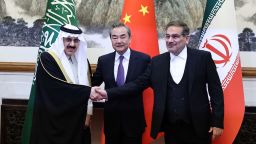 Top Chinese diplomat Wang Yi (middle), Ali Shamkhani, the secretary of Iran's Supreme National Security Council (right), and Minister of State and national security adviser of Saudi Arabia Musaad bin Mohammed Al Aiban (right) pose for pictures during a meeting in Beijing, China on Friday. 