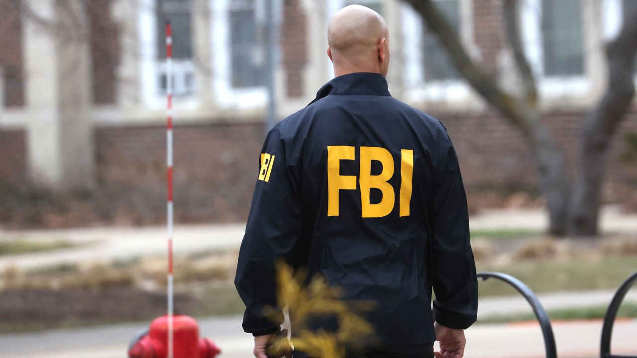 An FBI agent stands outside of Berkey Hall on the campus of Michigan State University on February 16, 2023 in East Lansing, Michigan.