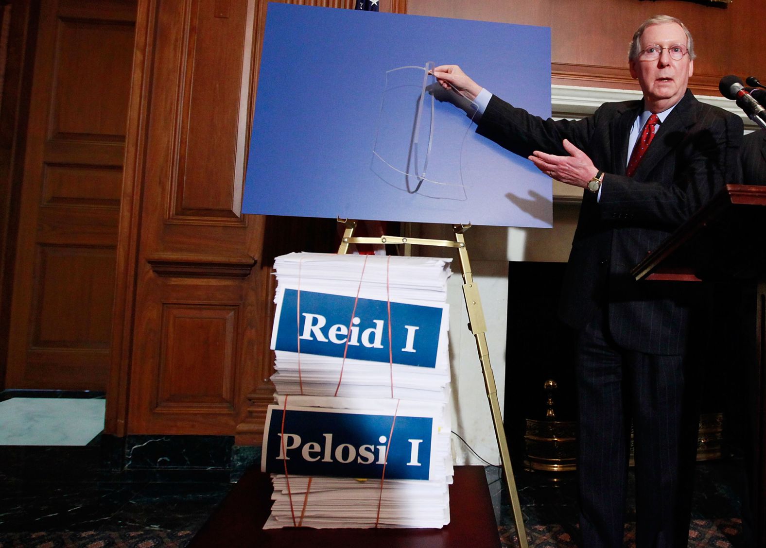 McConnell holds an empty binder strap while speaking about health-care reform on Capitol Hill in December 2009. McConnell and Sen. John McCain said that Republicans senators would do everything they could to delay passage of any health-care legislation.