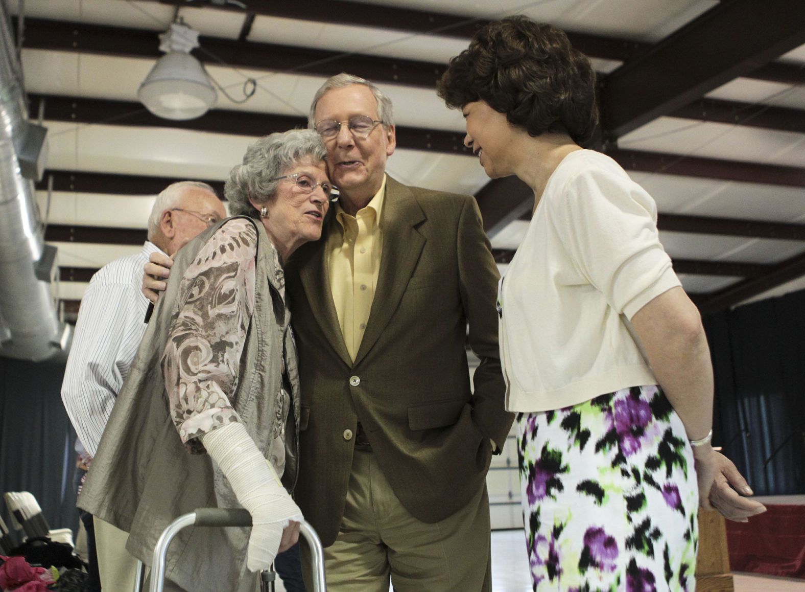 McConnell hugs Betty Lou Weddle, 82, after  speaking to a small audience in Liberty, Kentucky, in May 2014.