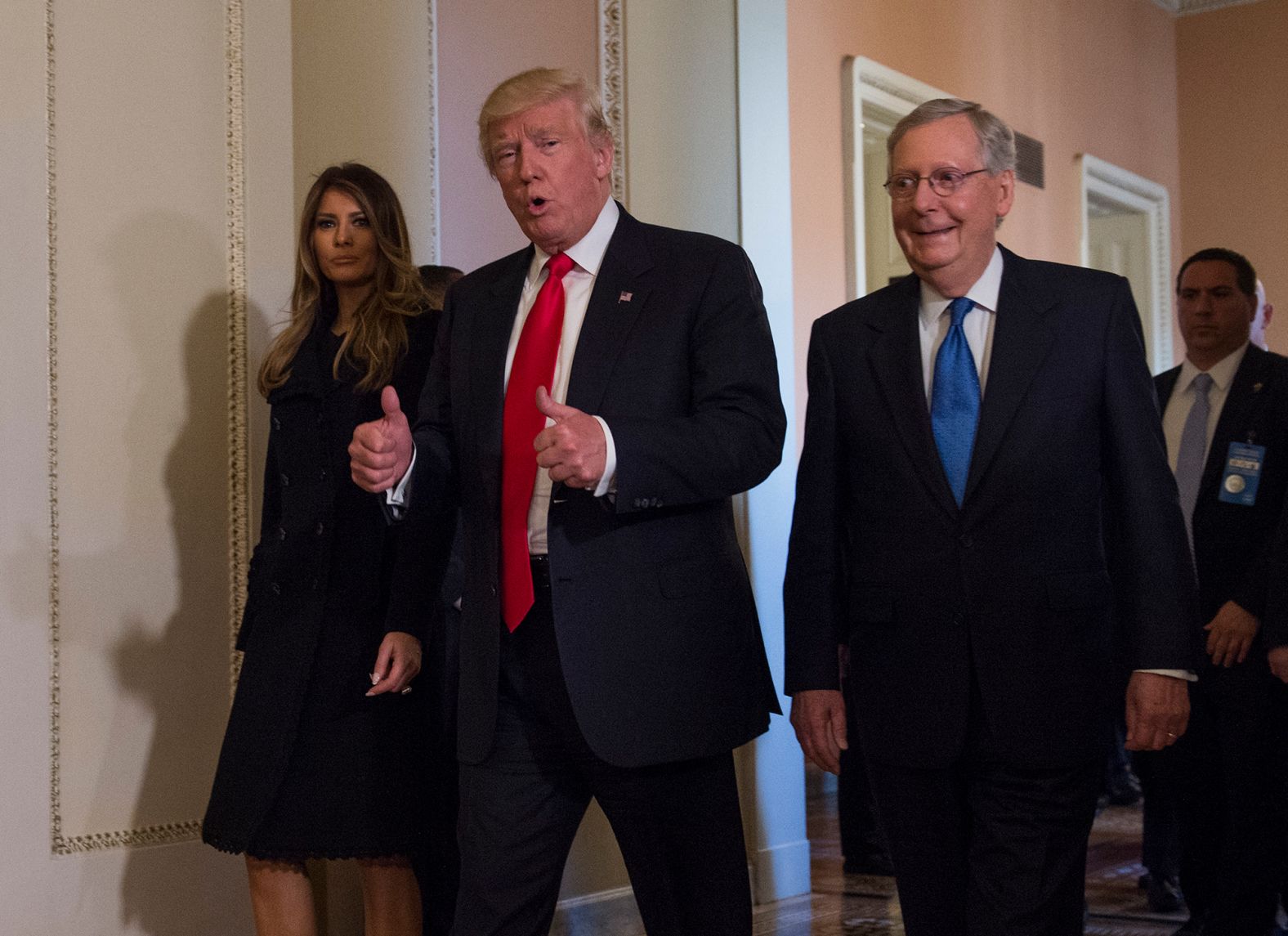 McConnell walks with President-elect Donald Trump and his wife, Melania, after a meeting at the Capitol in November 2016.