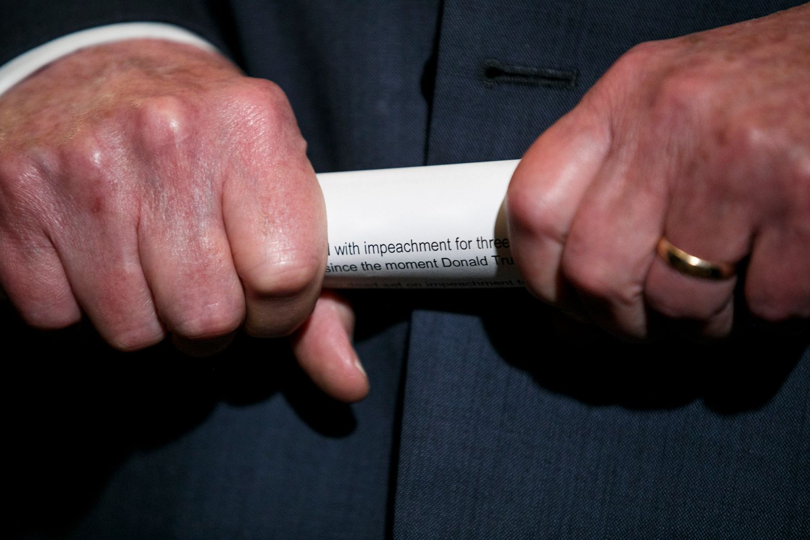 McConnell holds his notes as he listens to a question from a reporter in October 2019.