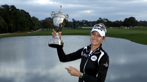 Korda poses with the Pelican Women's Championship trophy after winning in Bel Air, Florida.