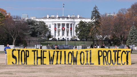 Demonstrators unfurl an anti-Willow Project banner outside the White House on December 2.