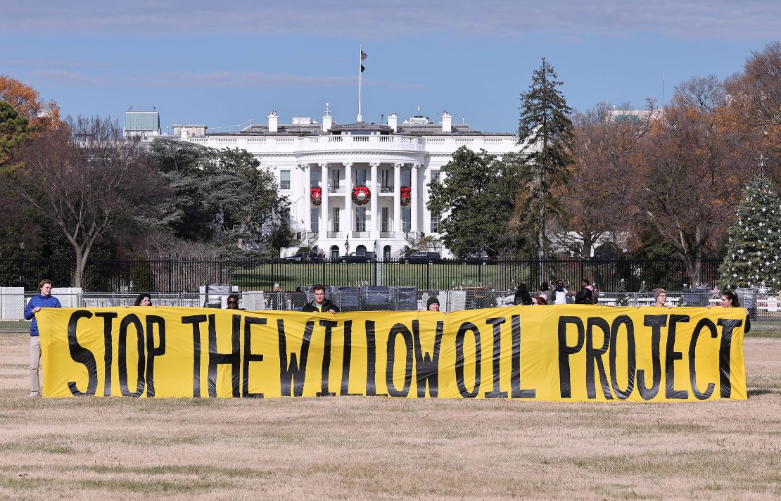 Demonstrators unfurl an anti-Willow Project banner outside the White House on December 2.