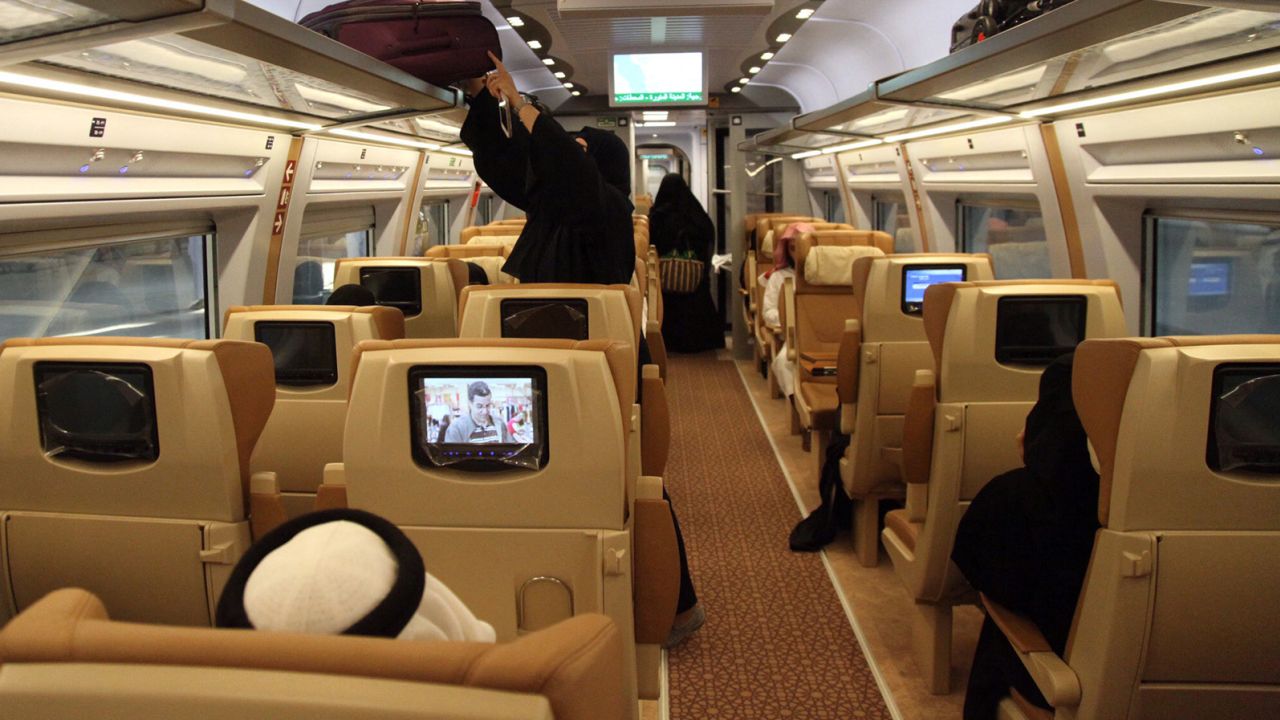 Business class passengers on the train can watch seat-back TVs.