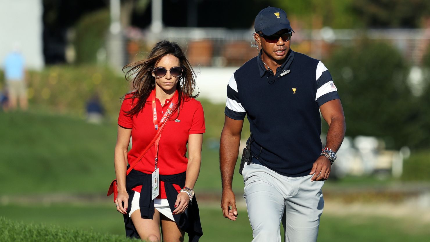 JERSEY CITY, NJ - SEPTEMBER 28:  Captain's assistant Tiger Woods of the U.S. Team walks with Erica Herman during Thursday foursome matches of the Presidents Cup at Liberty National Golf Club on September 28, 2017 in Jersey City, New Jersey.  (Photo by Rob Carr/Getty Images)