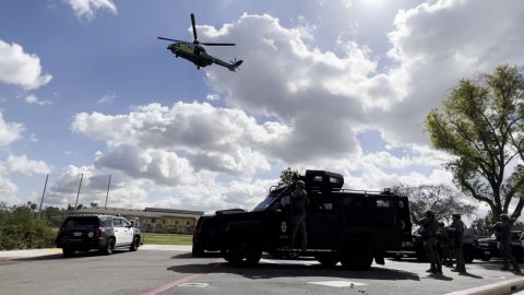 A helicipter hovers over the scene during the simulation.